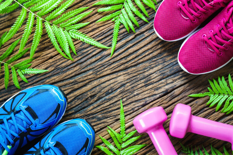 Dumbbells for resistance training and two pairs of shoes